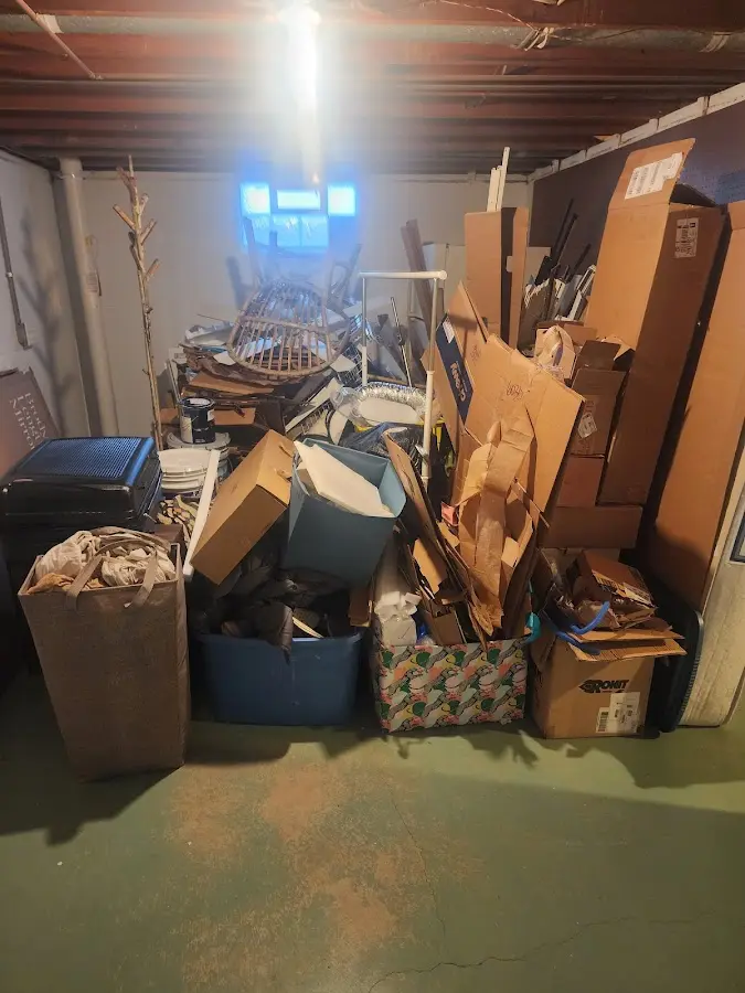 Roll-off dumpster container at job site for 2 Yard Dumpster Rental in Milford